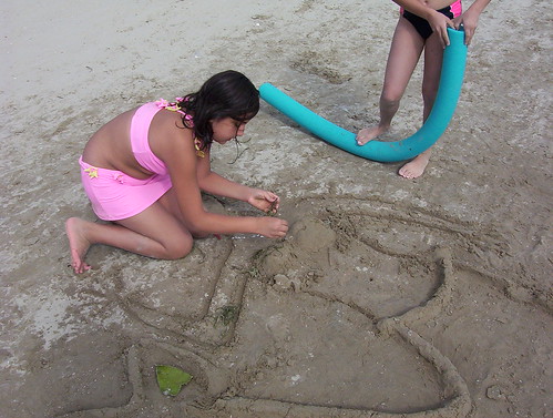Fixing the sand mermaid