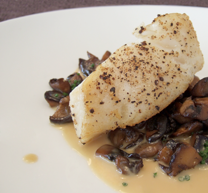 pan-seared chilean sea bass with mushroom and smoked bacon ragout and yuzu-butter saucer