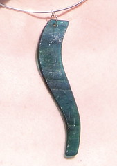 Green-blue pendant in close up
